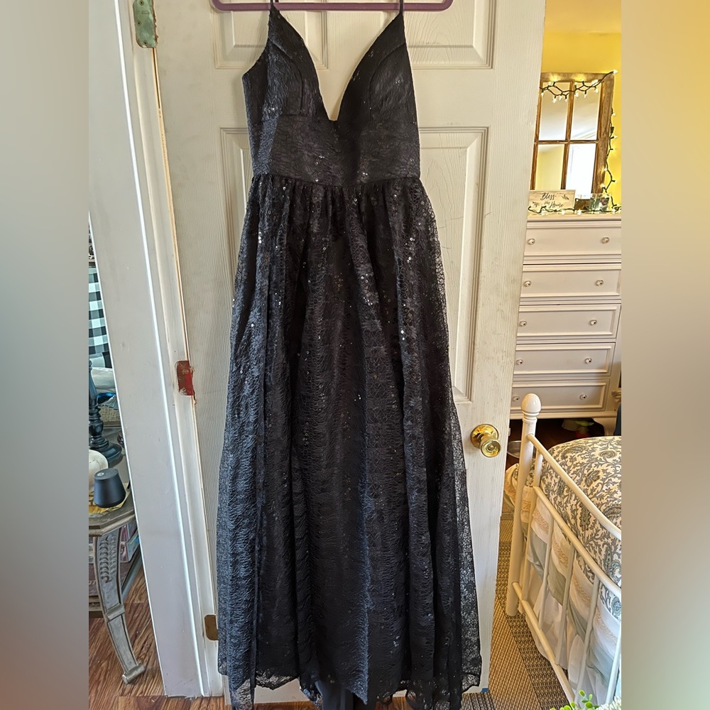 New never worn. Black lace with same color sequins ball gown for prom.